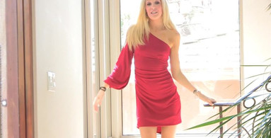 Astonishing blonde in red continues to bask in her own sexy glory