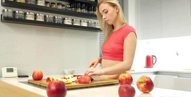 Cute starlet pleasures herself in the kitchen
