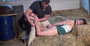 Tying and dominating a submissive woman in the barn