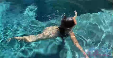 Mi Ha Doan spreads her legs while in the pool