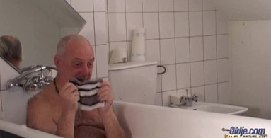 Old man relaxes in the tub before fucking a young babe