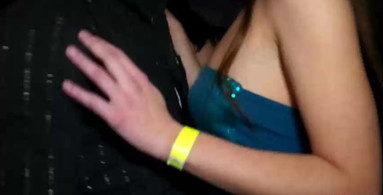Clothed slut in the club and giving him a titjob