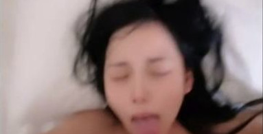 Lovely Asian girl with tiny tits is being filmed while sucking and riding