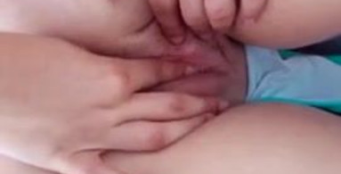 Girlfriends finger eachother on public beach with oil