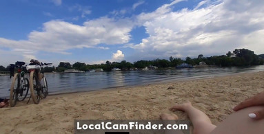 Girl caresses herself on a nude beach