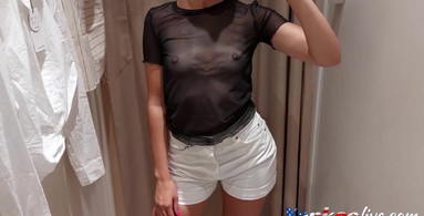 Sexy cutie takes a video of herself in the fitting room of the store