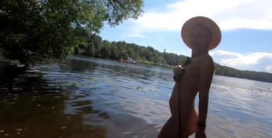An exhibitionist Girl walks on the Moscow River Nudist Beach Serebryany Bor