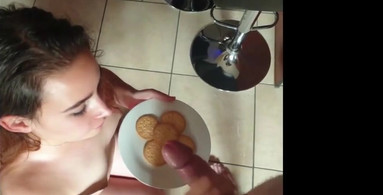 Slut eating cum covered cookies after giving the cock a sensual blowjob and